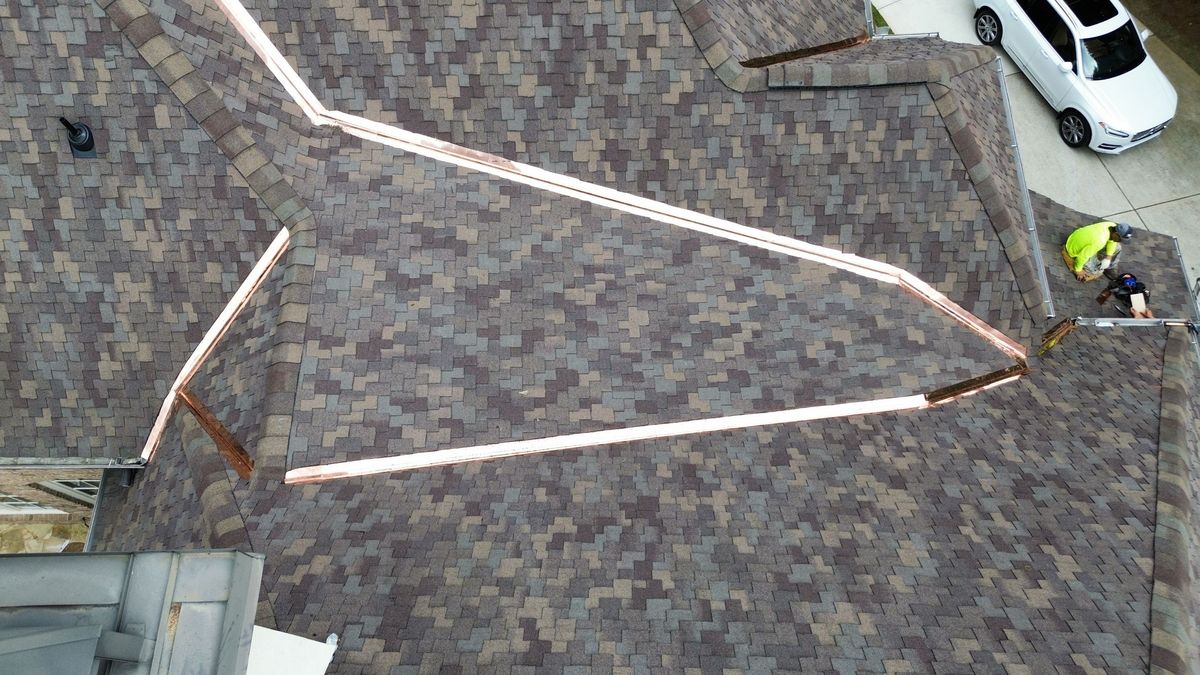 Completed copper valley detail on CertainTeed Presidential Autumn Blend roof