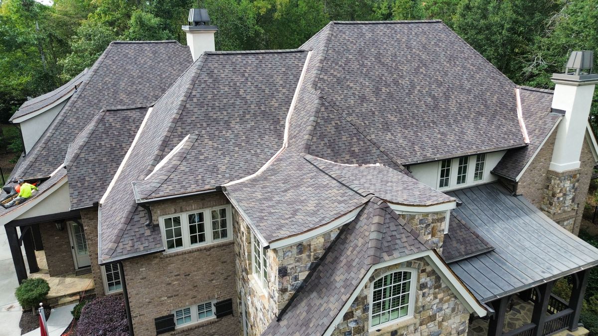 Front-left drone view of finished Presidential Shake Autumn Blend roof