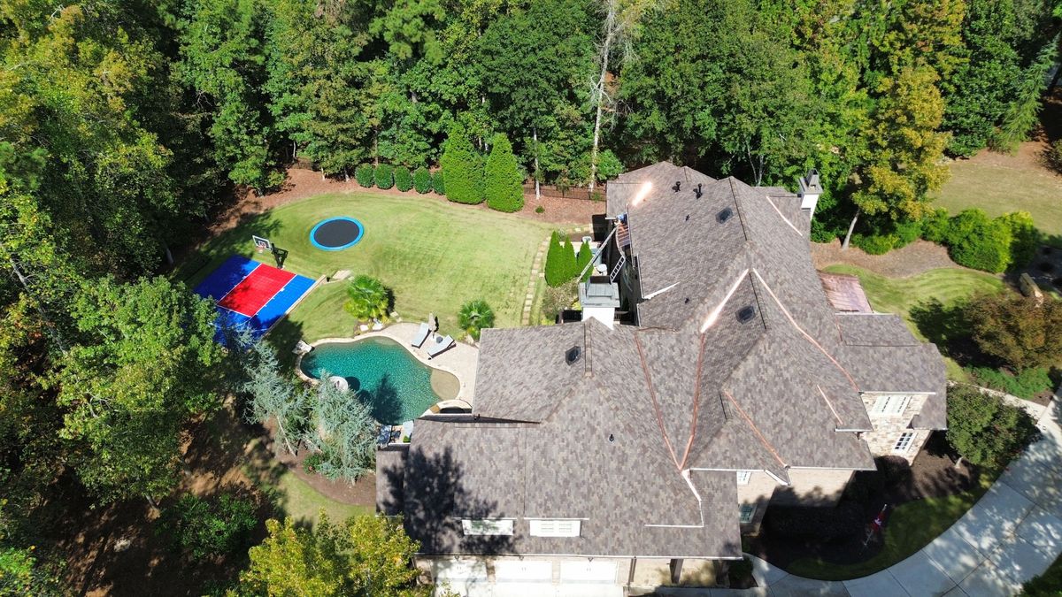 Left side drone overview of completed Presidential Autumn Blend roof replacement