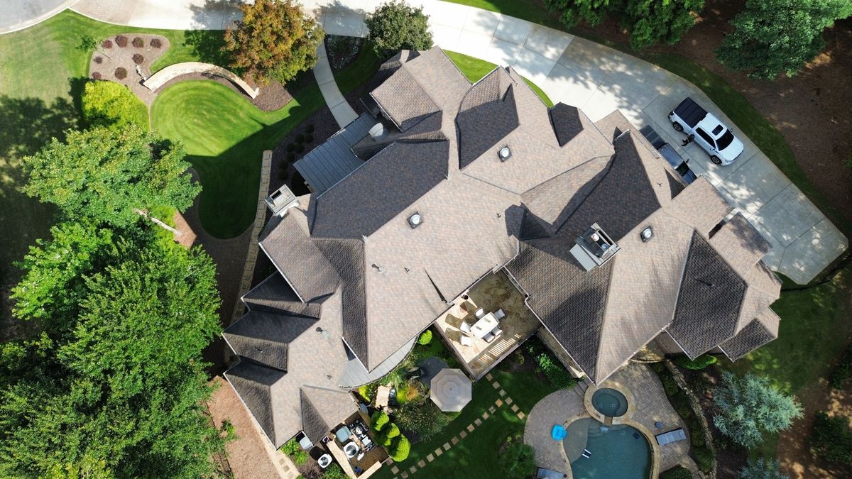 Aerial overview of aging roof before replacement with Presidential Shake shingles