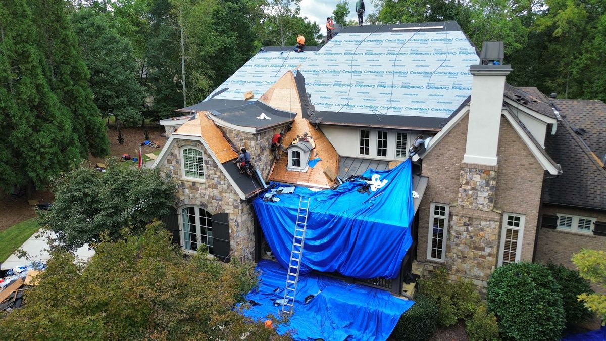 Drone front view of Presidential Autumn Blend roof during installation