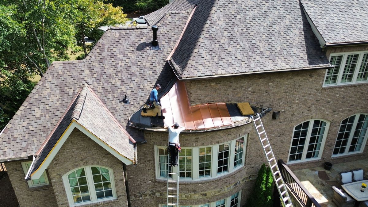 Crew installing CertainTeed Presidential Shake Autumn Blend shingles