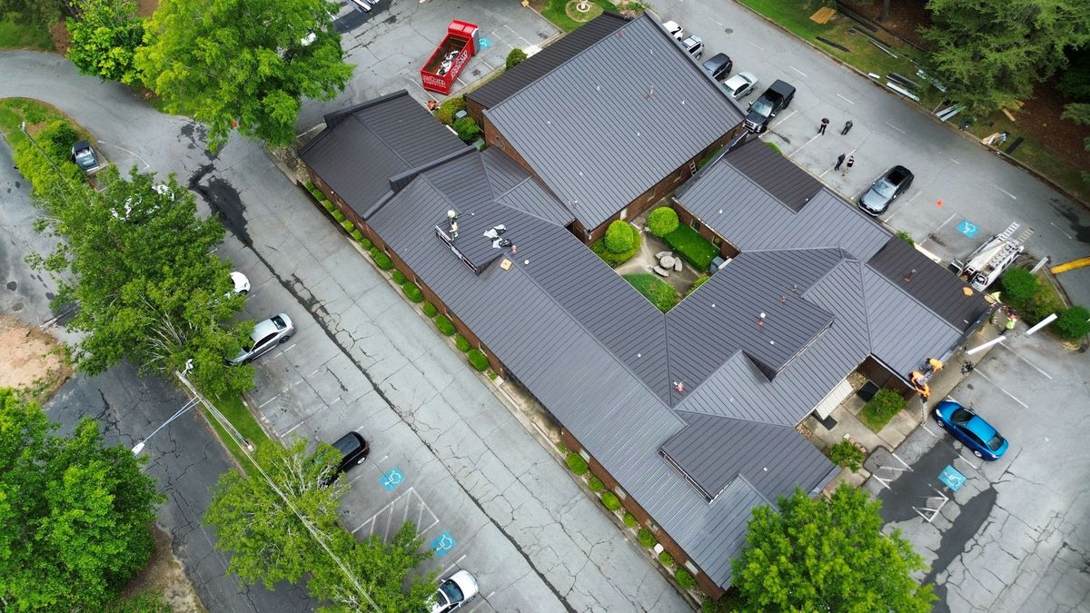 Commercial metal building roof replacement - aerial drone view of completed project