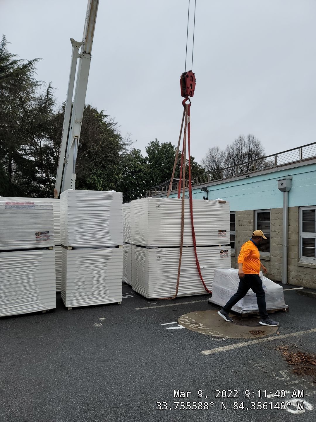 Commercial roof replacement — TPO membrane and paver installation progress