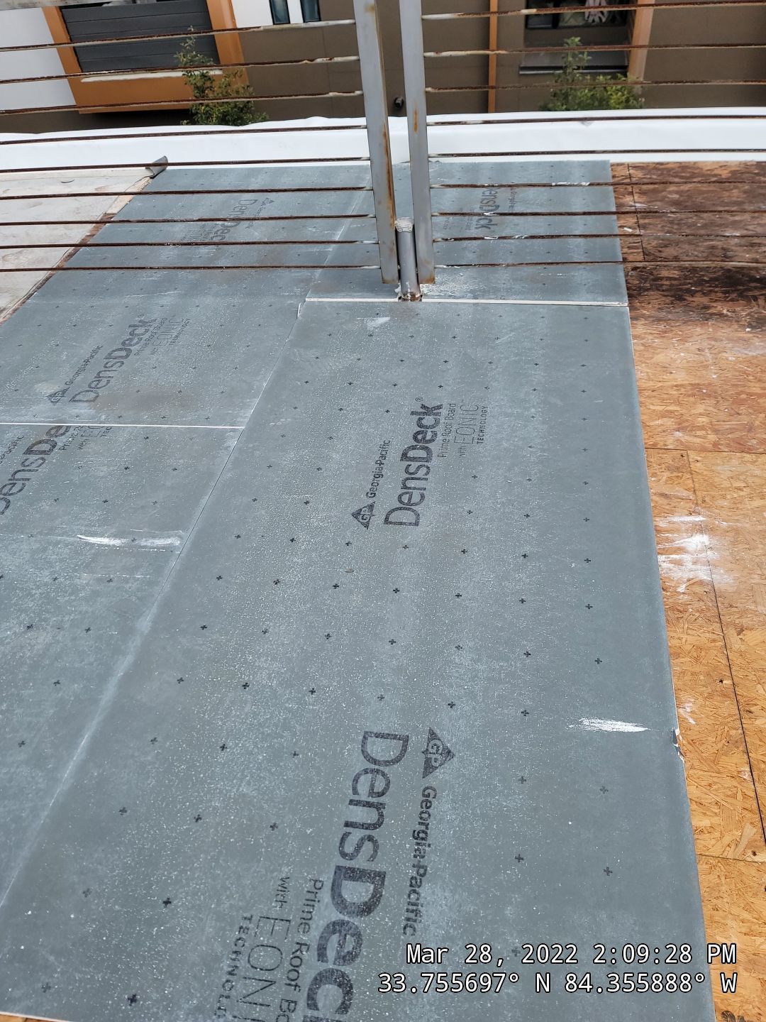 Drone documentation of commercial TPO roof replacement with walkable pavers