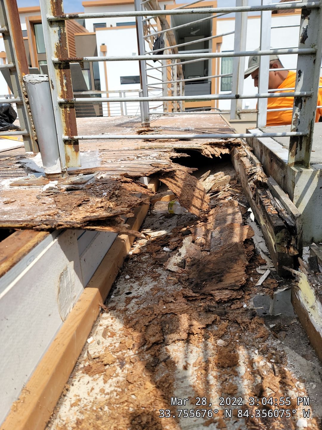 Commercial TPO roof during major rotted decking repair and membrane installation