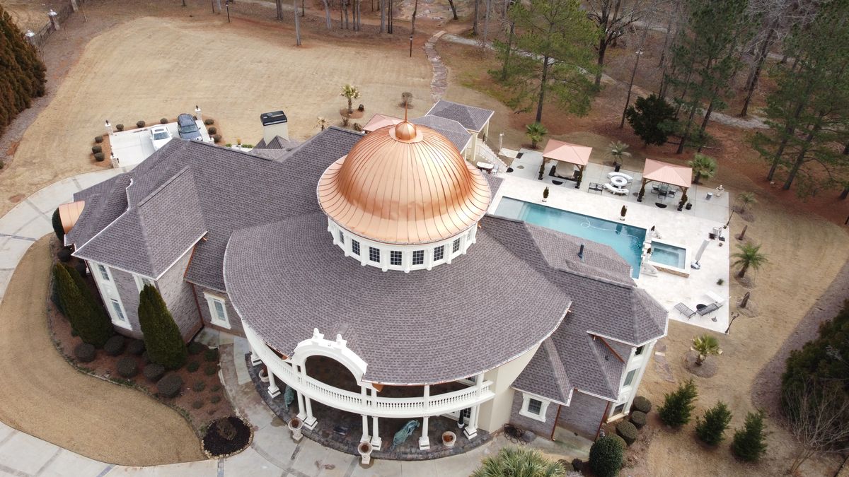Completed luxury estate GAF Timberline HDZ Mission Brown roof — aerial view