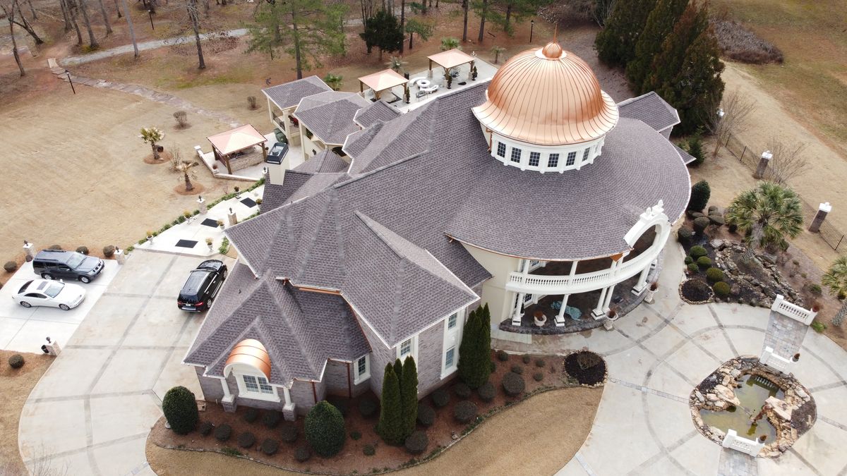 Luxury estate roof completed — GAF Timberline HDZ Mission Brown with copper accents