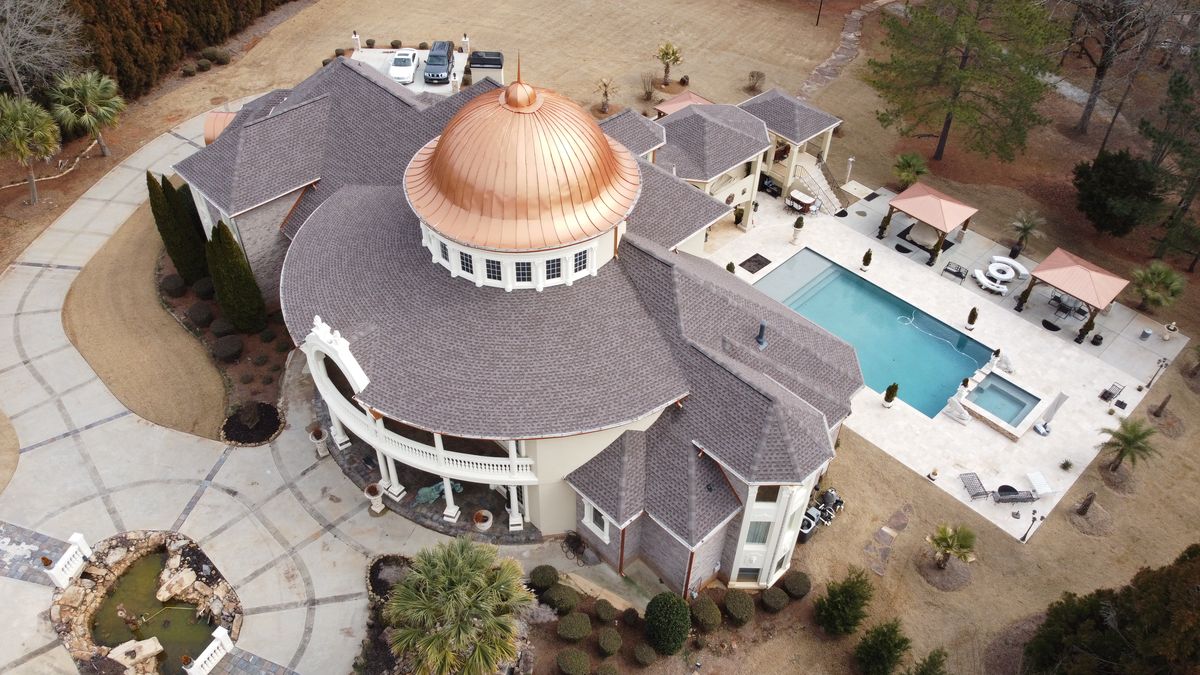 Main showpiece photo — completed luxury estate GAF HDZ Mission Brown roof