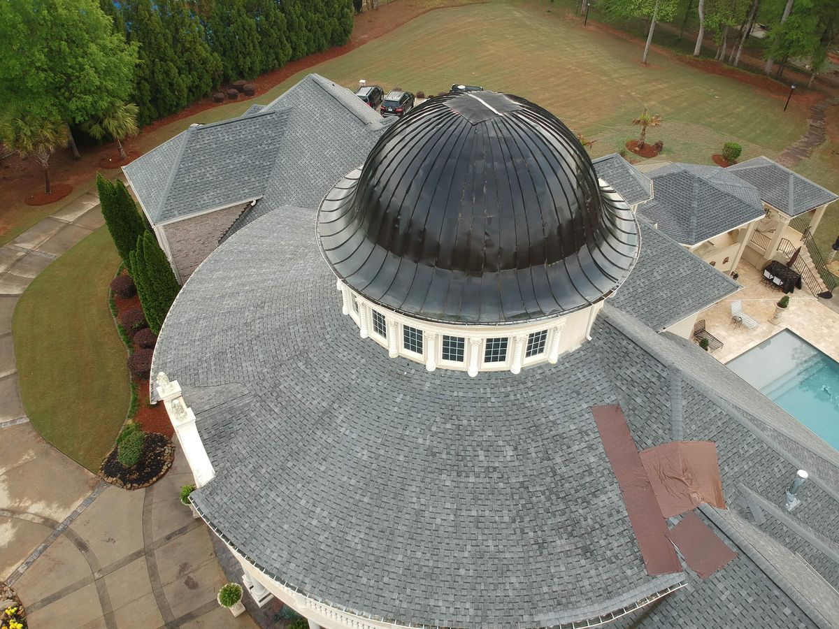 Luxury estate roof before GAF Timberline HDZ Mission Brown replacement — front view