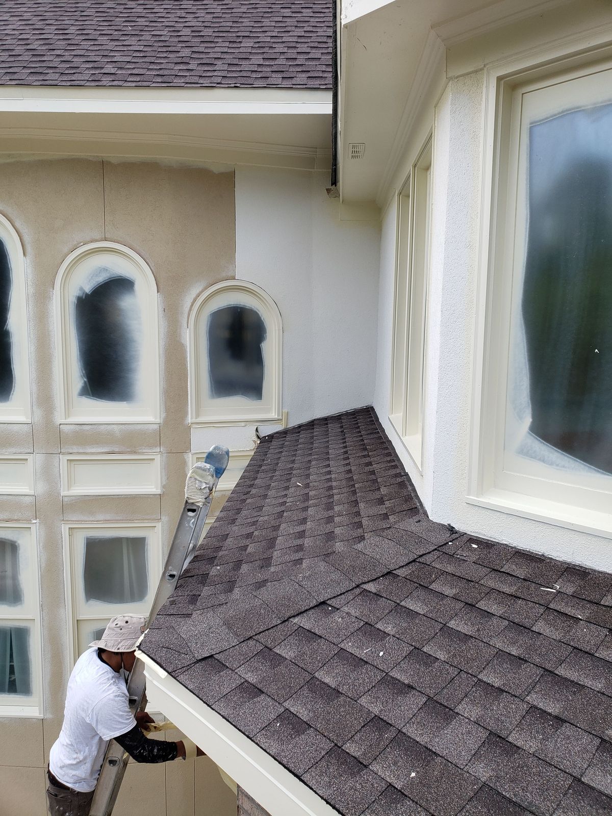 Estate roof replacement — new Mission Brown shingles and copper gutters