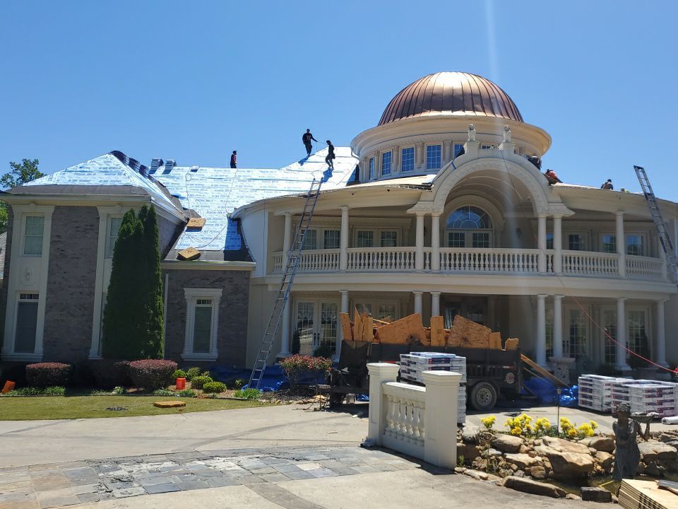 Copper flashing detail work during estate roof installation
