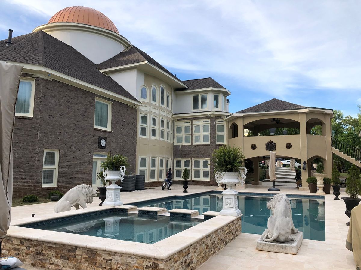 Estate home roof replacement — crew working on GAF HDZ Mission Brown
