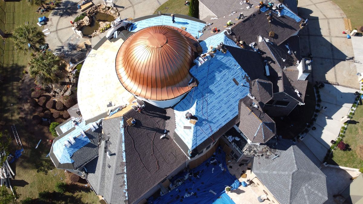 Estate roof — stucco and roof interface detail during replacement