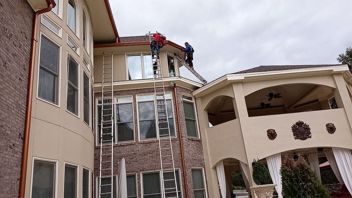 Overhead drone view of estate roof replacement in progress