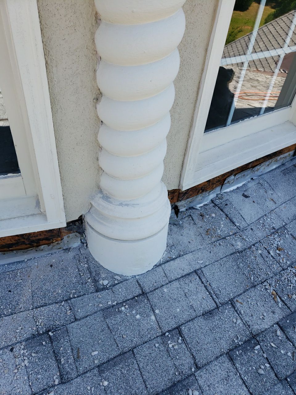 Estate home stucco restoration alongside roof replacement