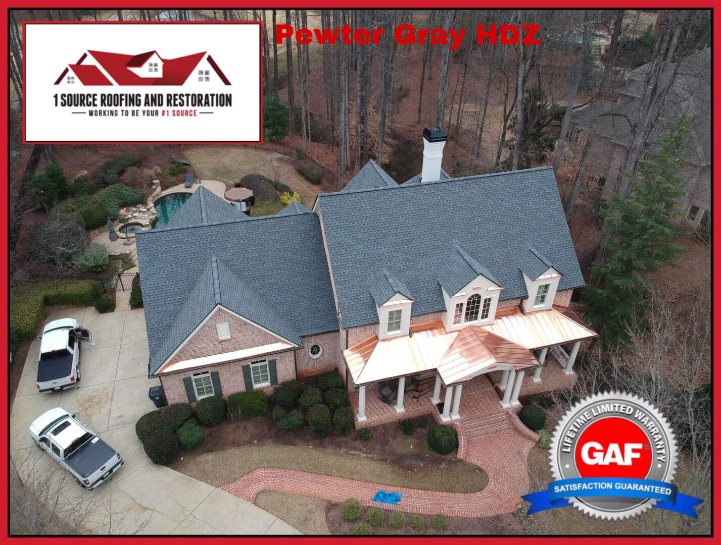 Here's an alt tag for the image, within the 8-word limit: Pewter Gray HDZ roof on luxury home.